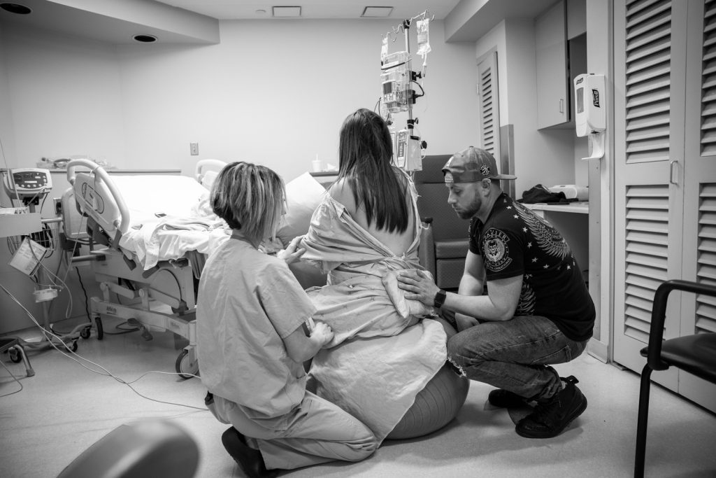 caring for pregnant woman on medicine ball